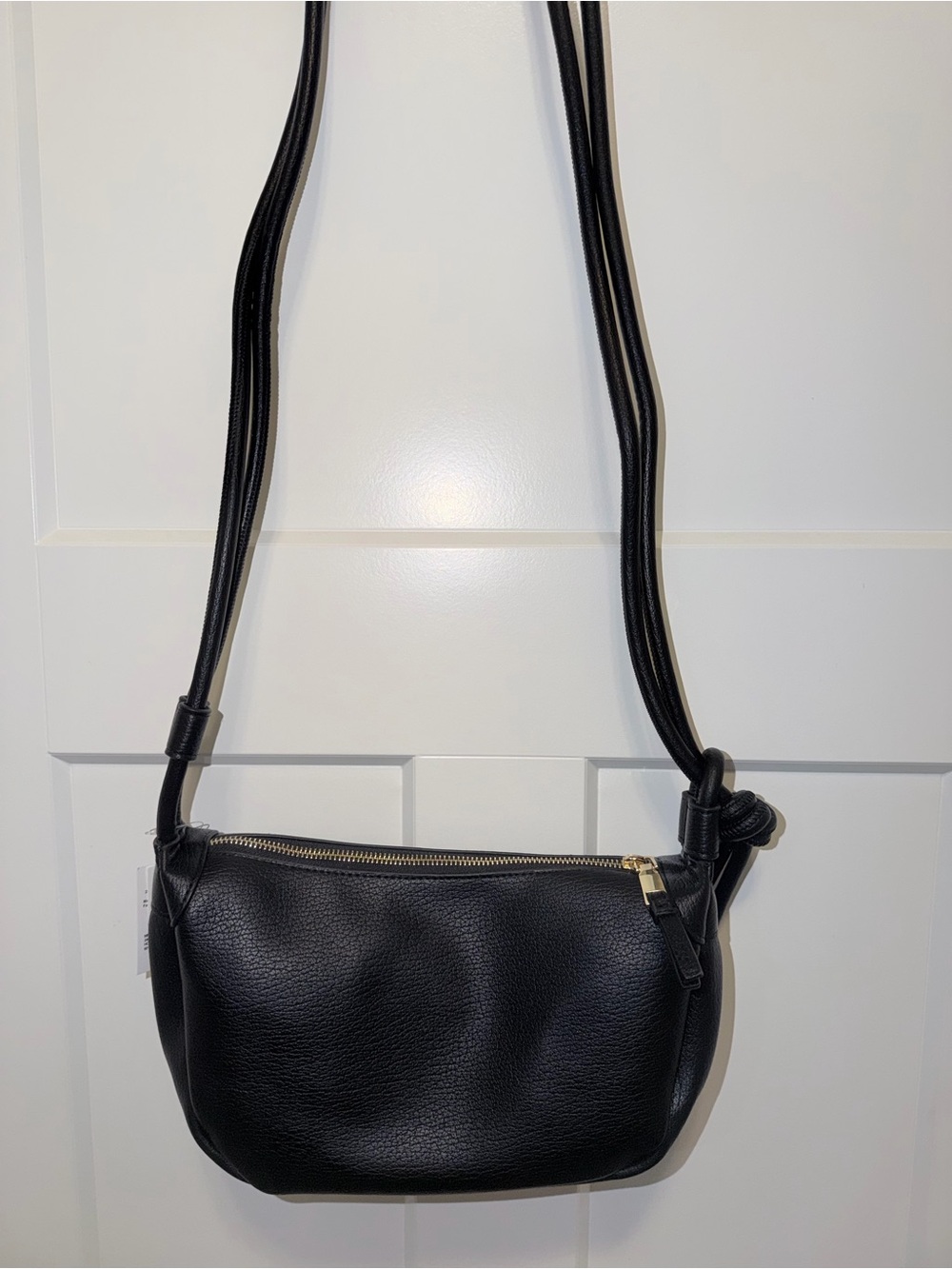 A black pebbled faux-leather shoulder bag